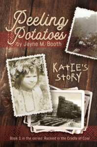 The cover of the book, Katie's Story, that features black and white photos on a wood table with details of embroiders from a traditional vyshivanka.